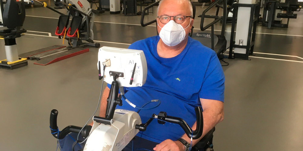 Man on an Functional Electrical Stimulation exercise bike